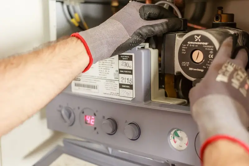 White combi boiler mounted on a kitchen wall