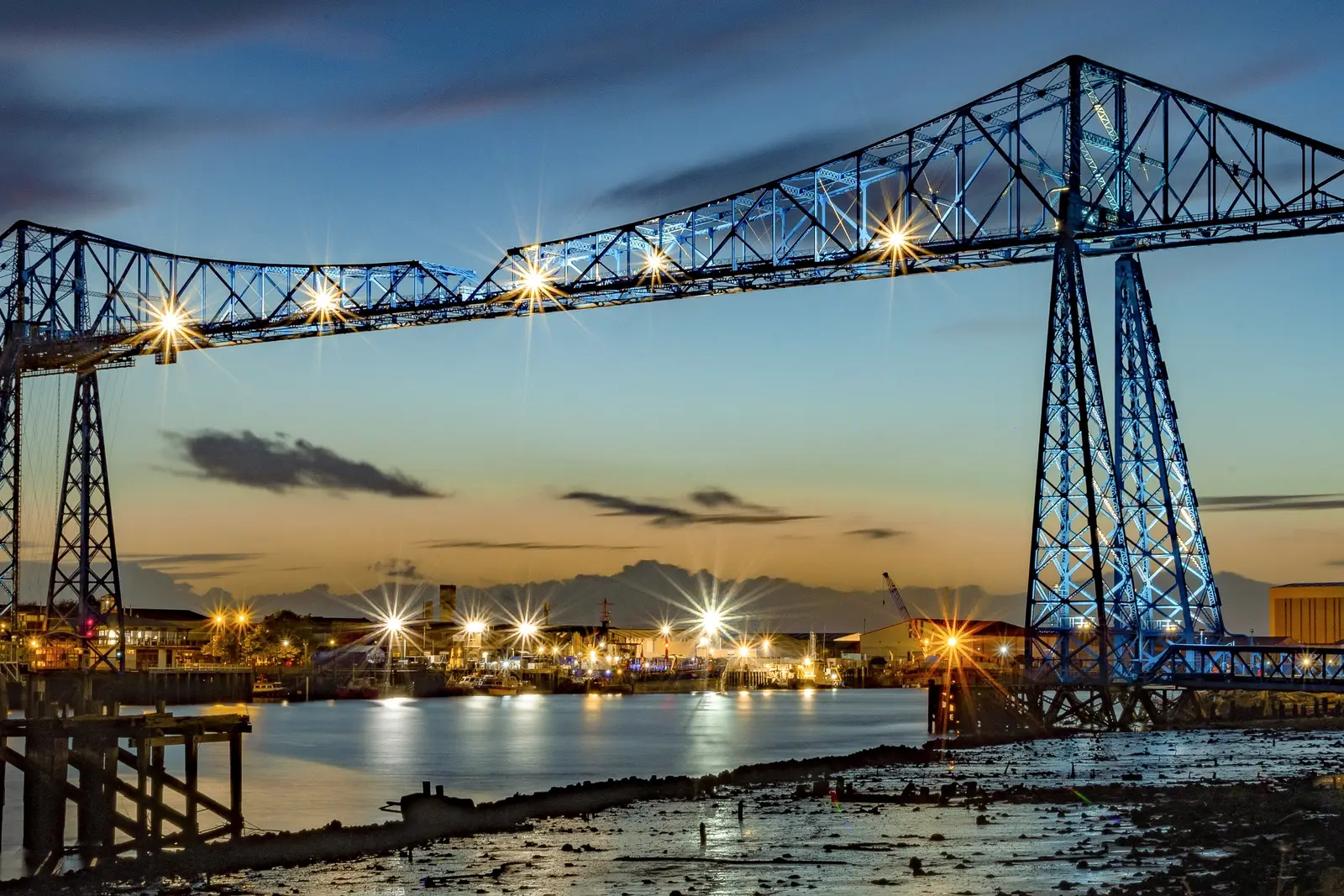 Tees Transporter Bridge lit up at dusk over the River Tees, Middlesbrough