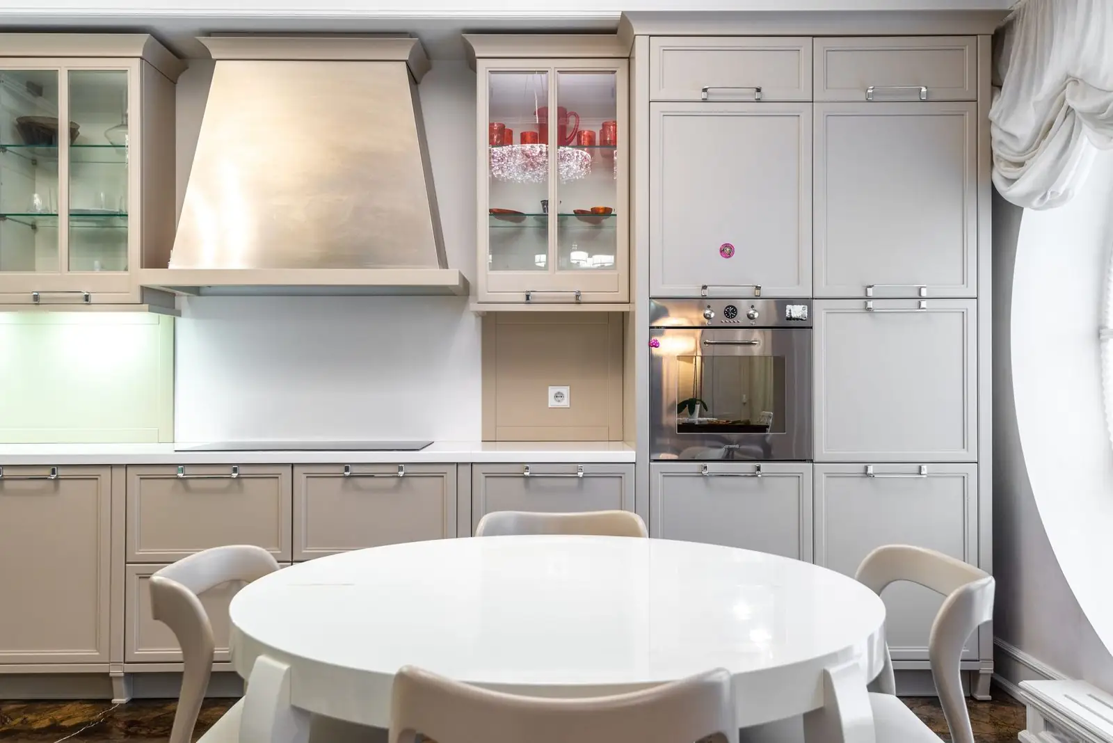 Newly fitted modern kitchen with white units and wooden worktops